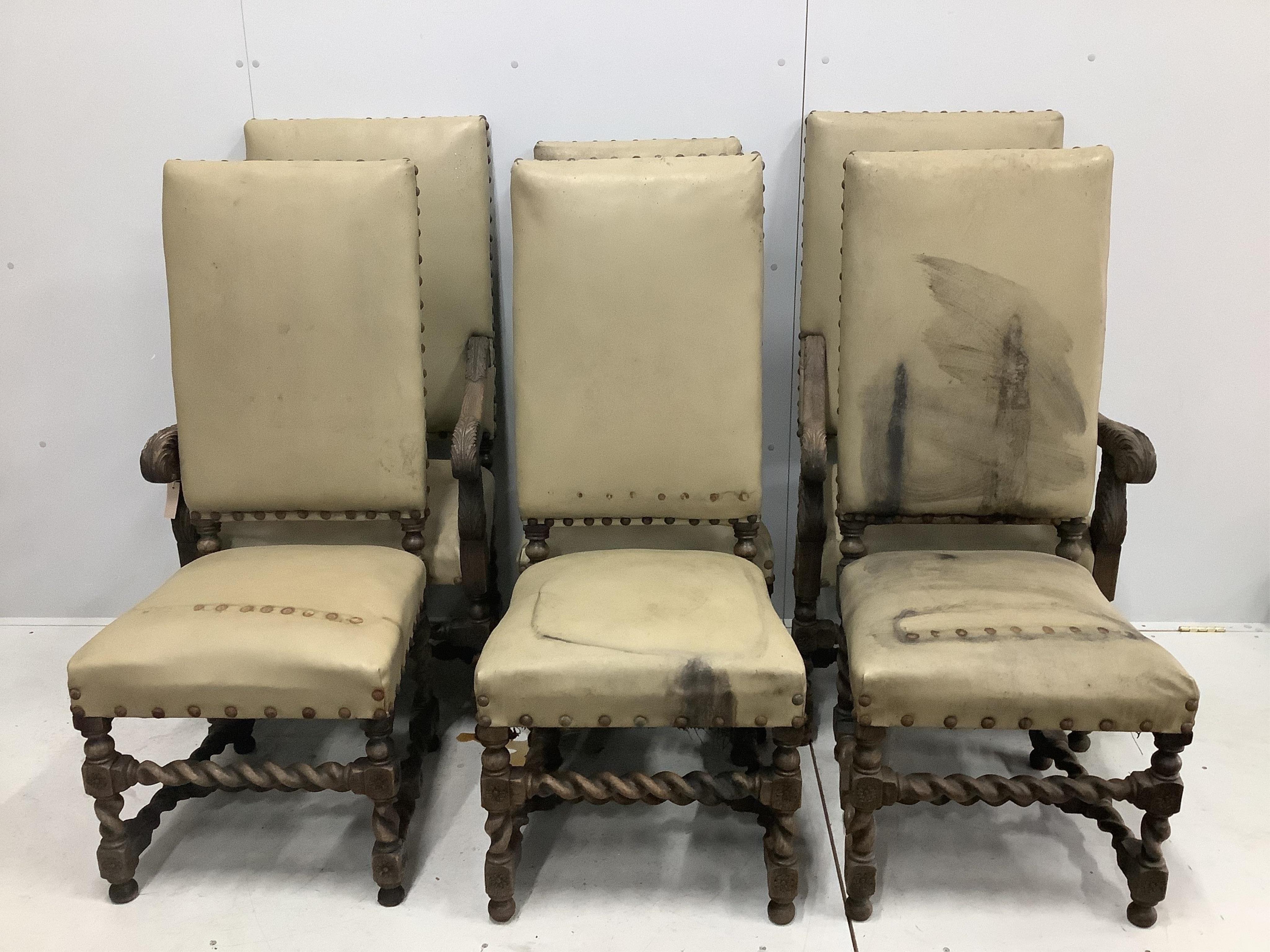 Six Carolean style carved oak dining chairs, two with arms. Condition - poor to fair